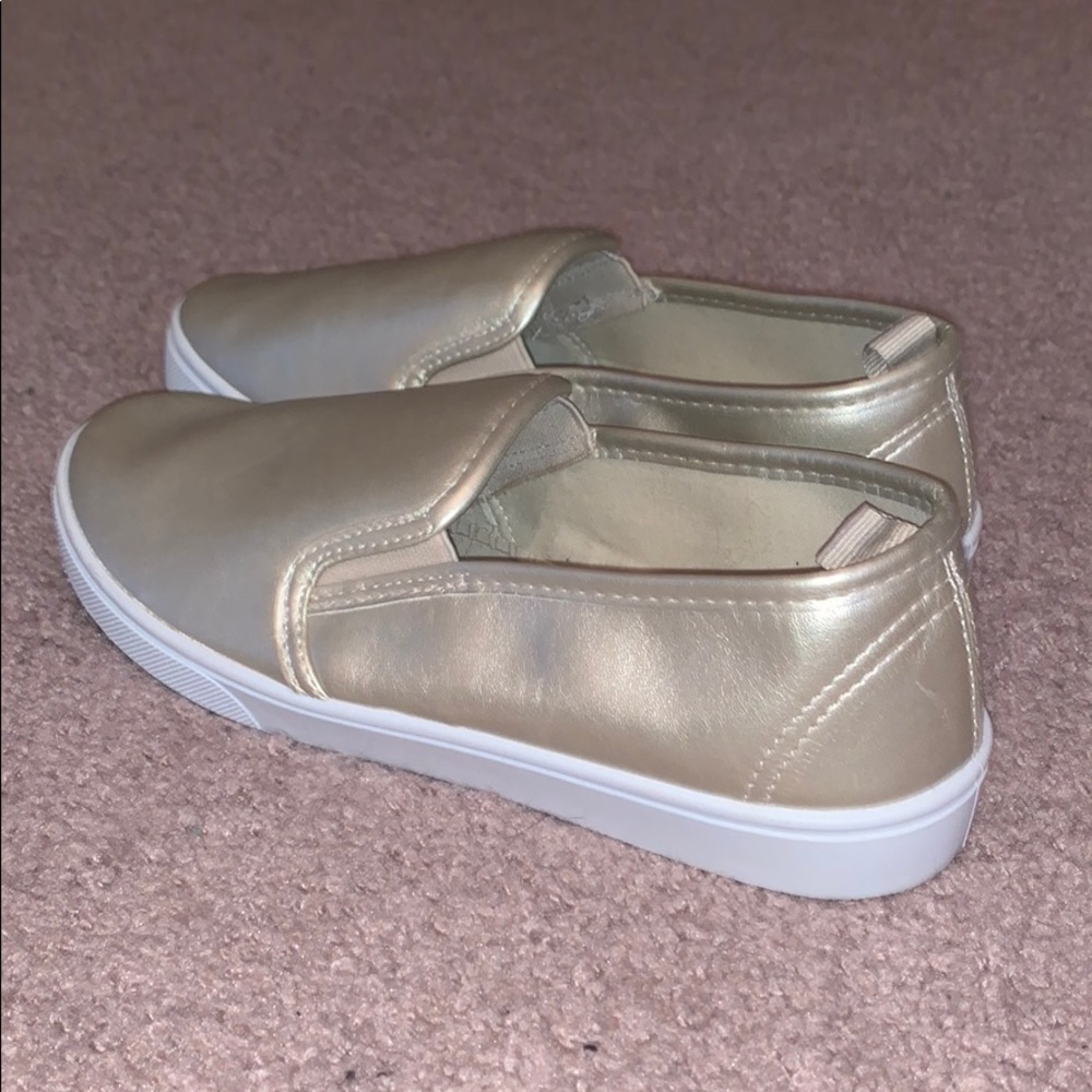 Gold slip on sneakers